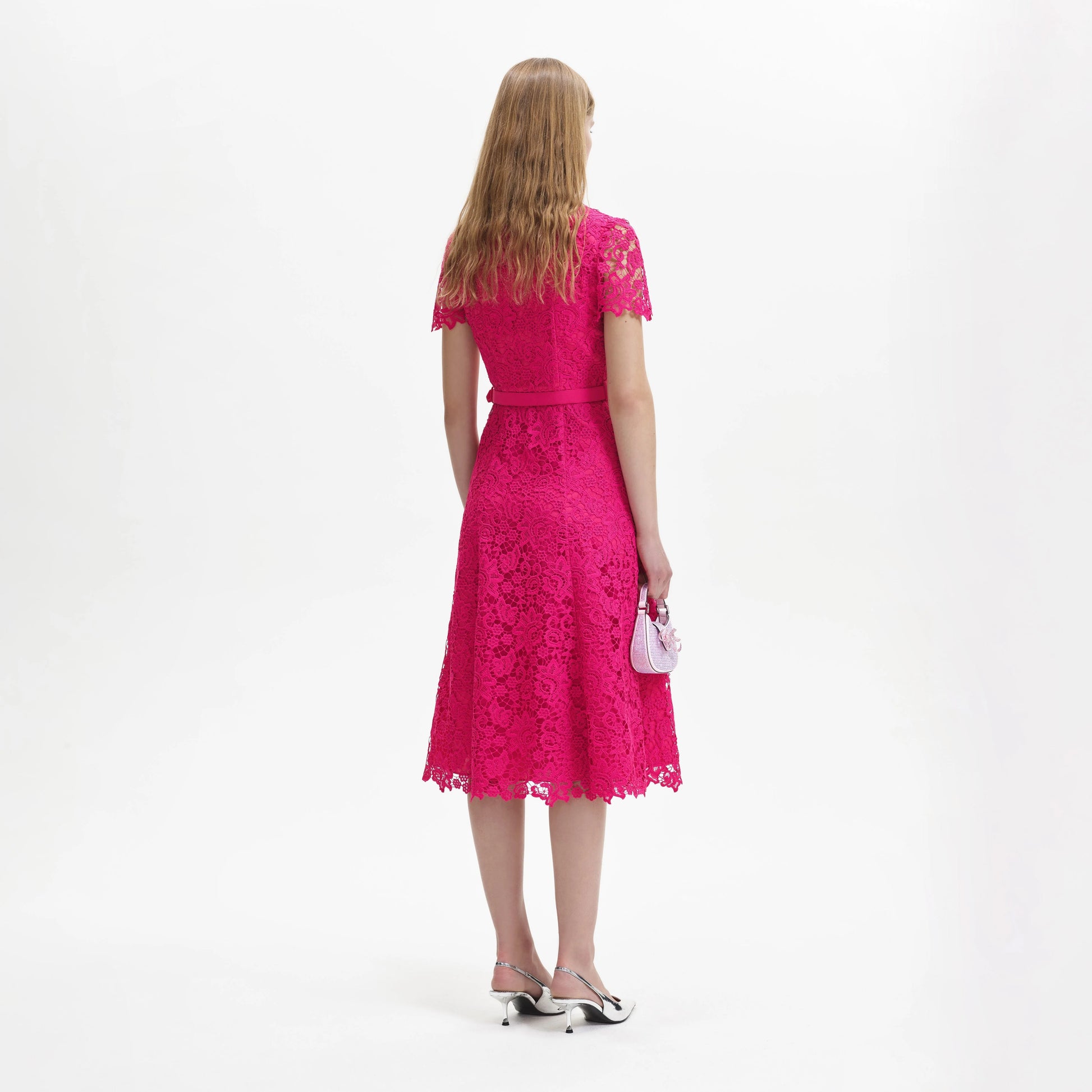 Hot pink lace wrap dress with short sleeves and a waist belt