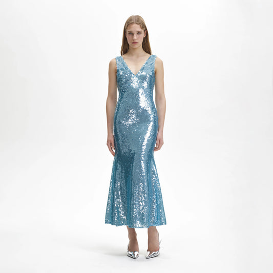 Blue sequin dress with a V neck and a fish tail skirt