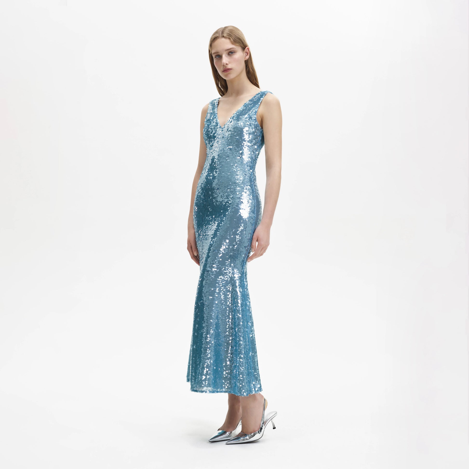 Blue sequin dress with a V neck and a fish tail skirt