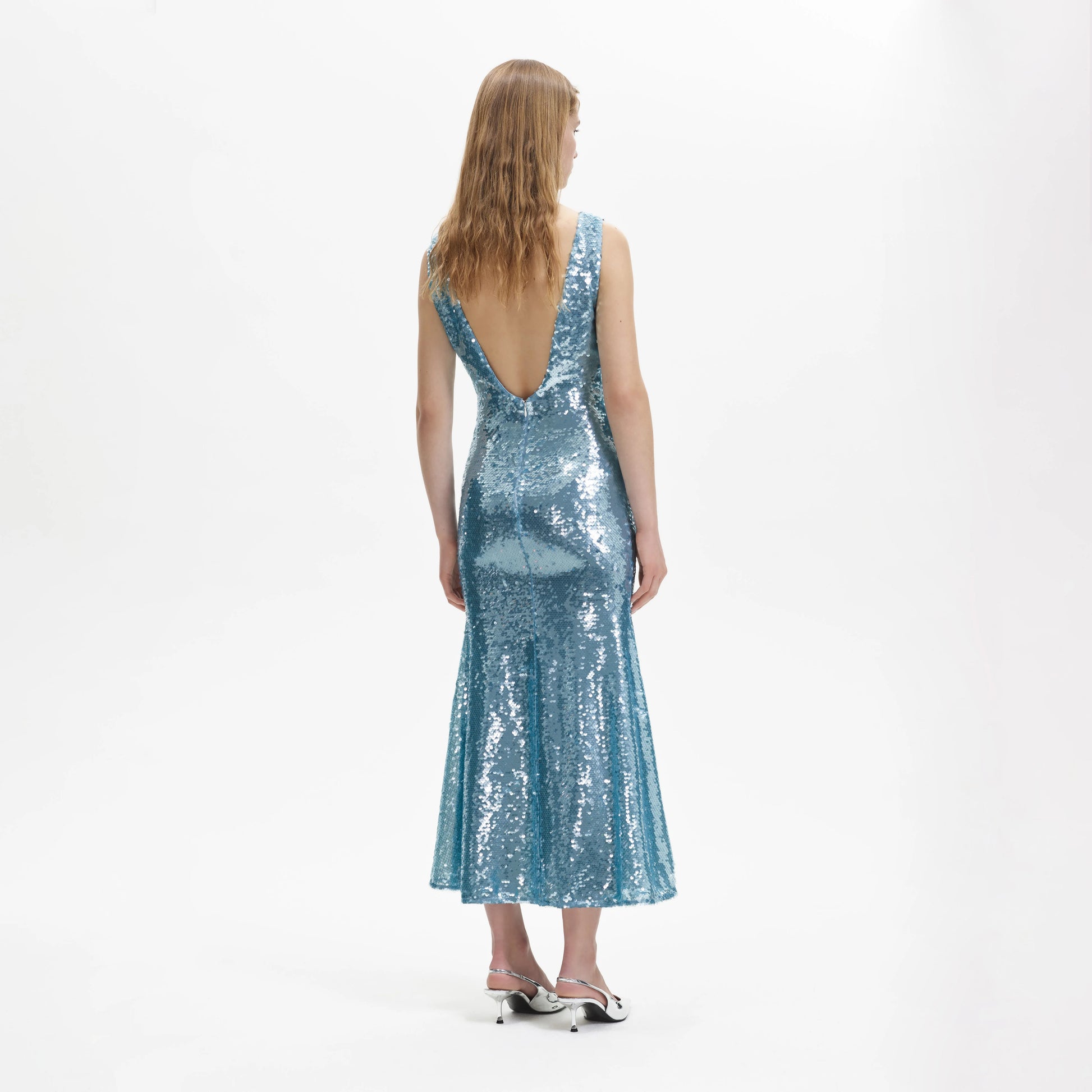 Blue sequin dress with a V neck and a fish tail skirt