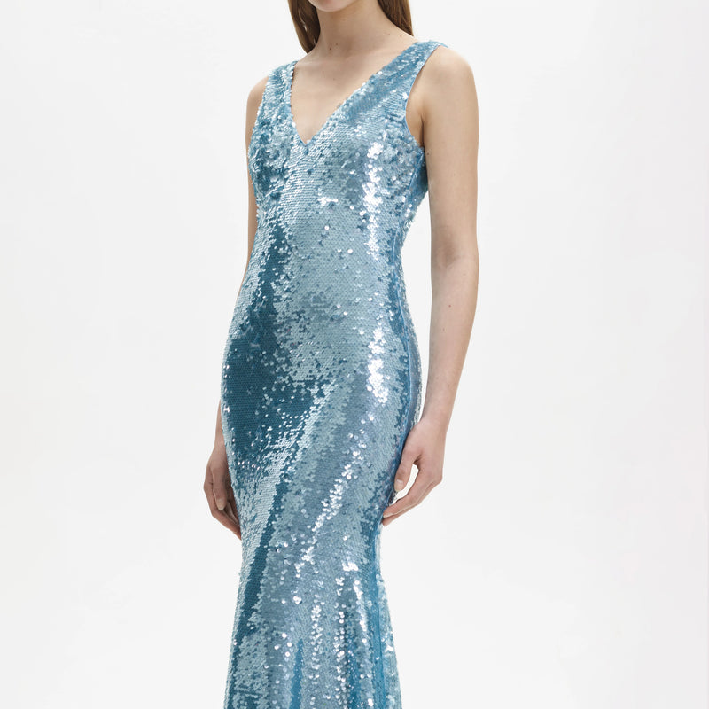 Blue sequin dress with a V neck and a fish tail skirt