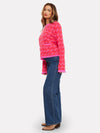 pink check cashmere jumper with 2 front pockets and frayed edge cuffs, neck and hemline side view 