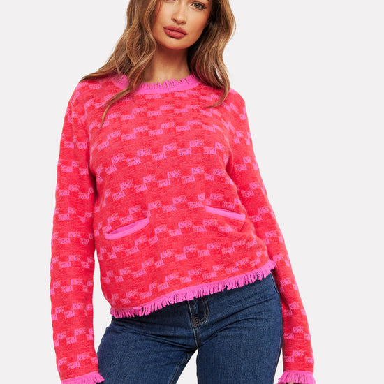 pink check cashmere jumper with 2 front pockets and frayed edge cuffs, neck and hemline