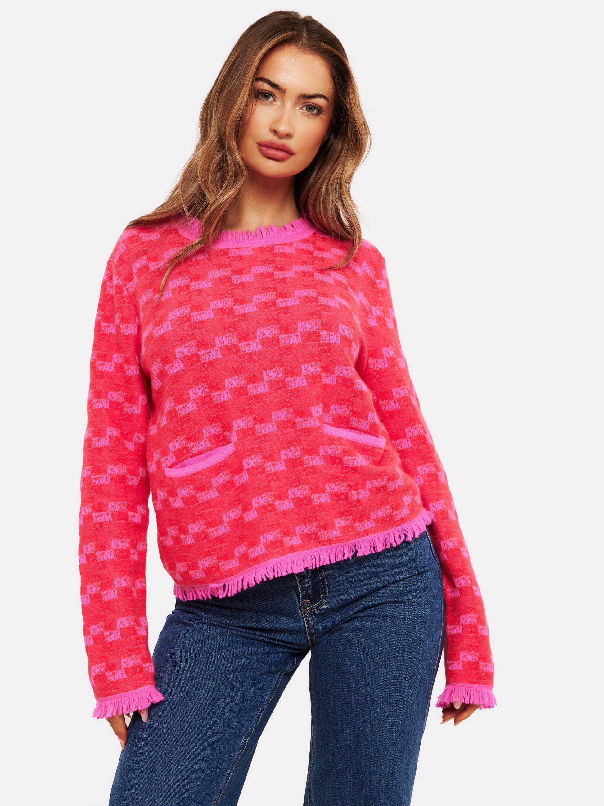 pink check cashmere jumper with 2 front pockets and frayed edge cuffs, neck and hemline