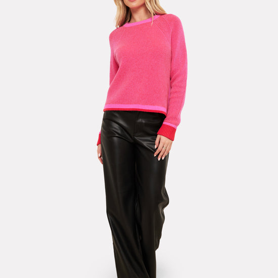 pink and red rib round neck cashmere jumper worn with black trouser