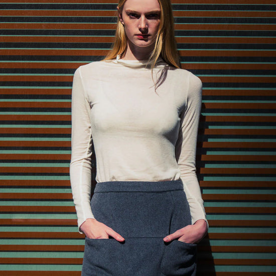 super soft long sleeve off white top with high round neck