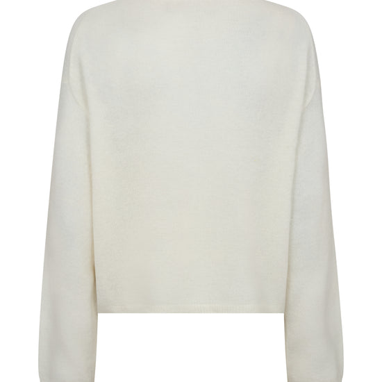 Back of ecru sweater on a white background