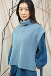 light blue knitted vest with rib detailing, sleeveless and roll neck
