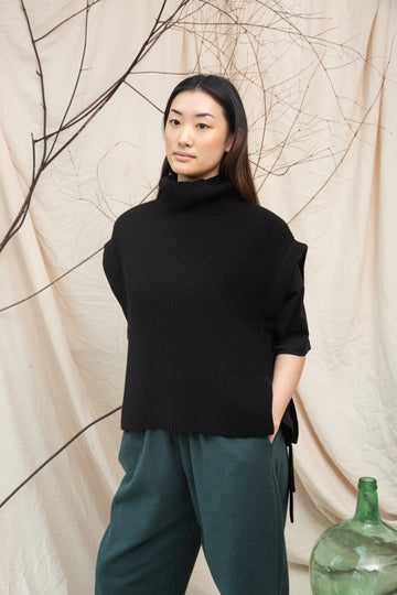 black knitted vest with rib detailing, sleeveless and roll neck
