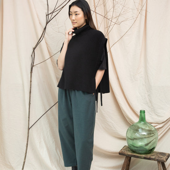 black knitted vest with rib detailing, sleeveless and roll neck