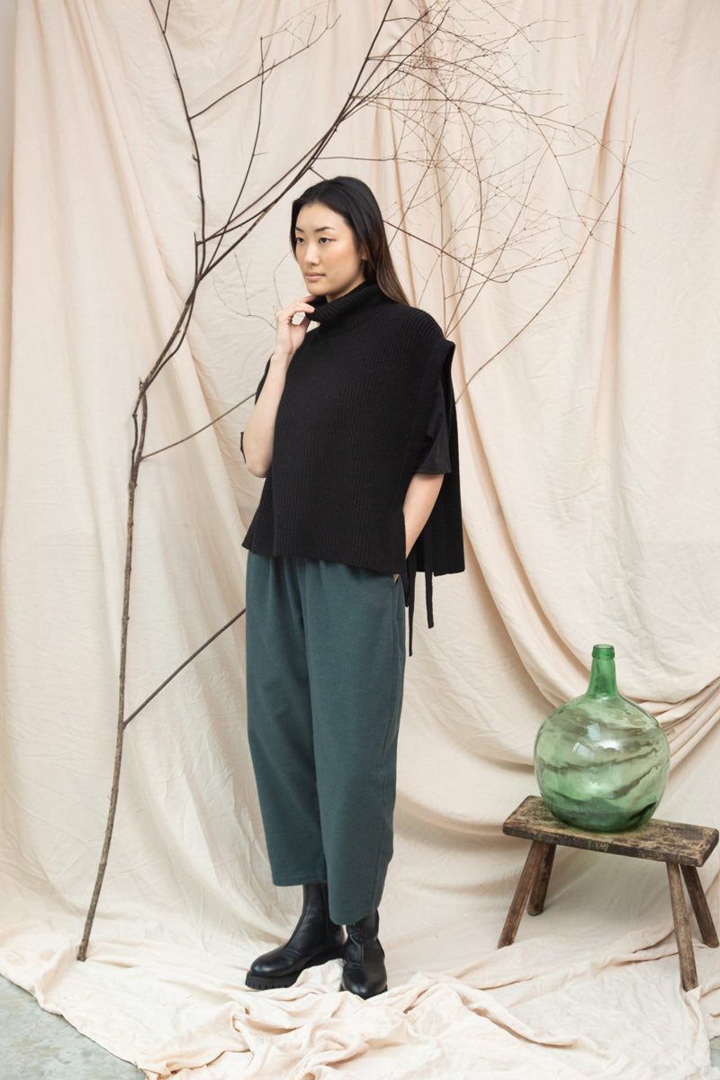 black knitted vest with rib detailing, sleeveless and roll neck