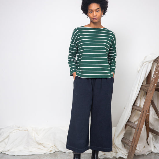 green and off white stripe top with boat neck and long sleeves model shot