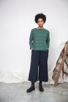 green and off white stripe top with boat neck and long sleeves model shot