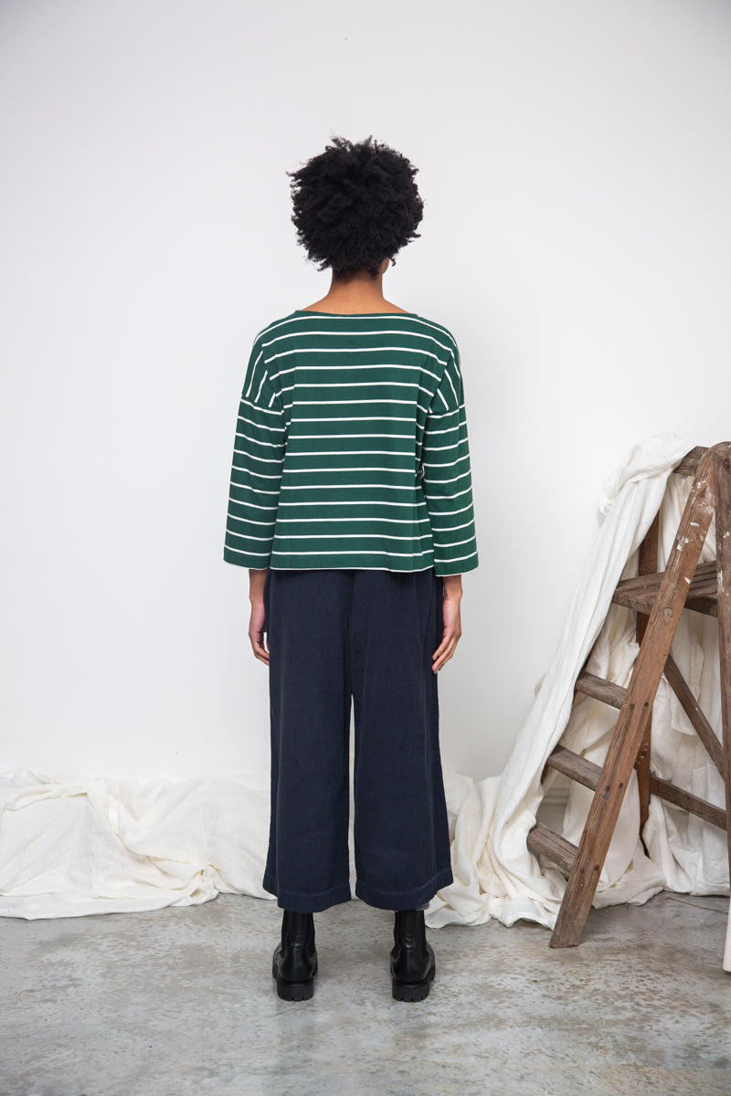 green and off white stripe top with boat neck and long sleeves rear view