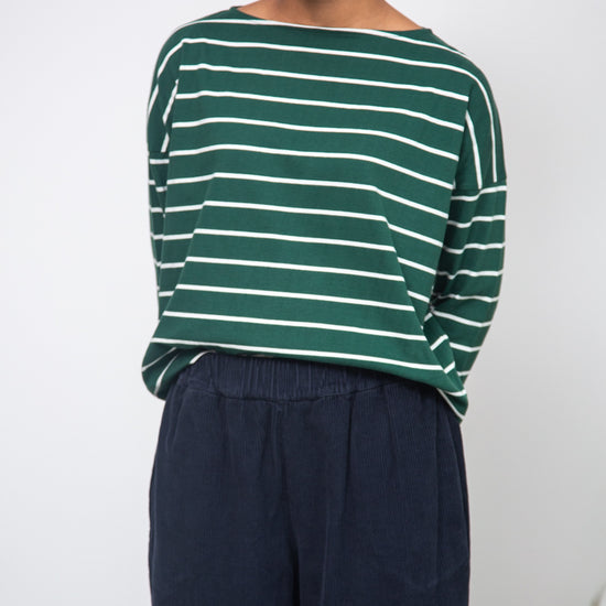 green and off white stripe top with boat neck and long sleeves model shot
