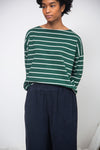 green and off white stripe top with boat neck and long sleeves model shot