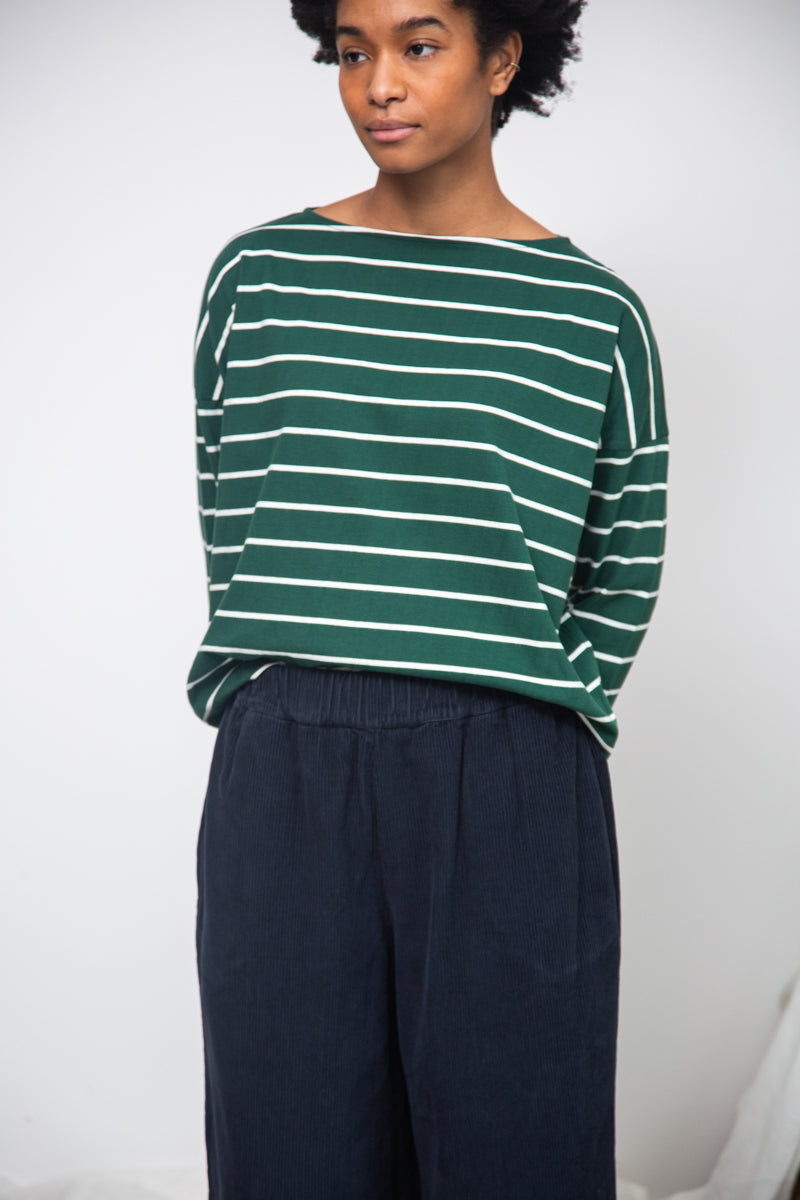 green and off white stripe top with boat neck and long sleeves model shot