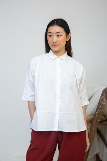 short sleeve white shirt with boxy fit and peter pan collar