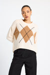 cream round neck cashmere jumper with rib detailing and tan argyle design on the front