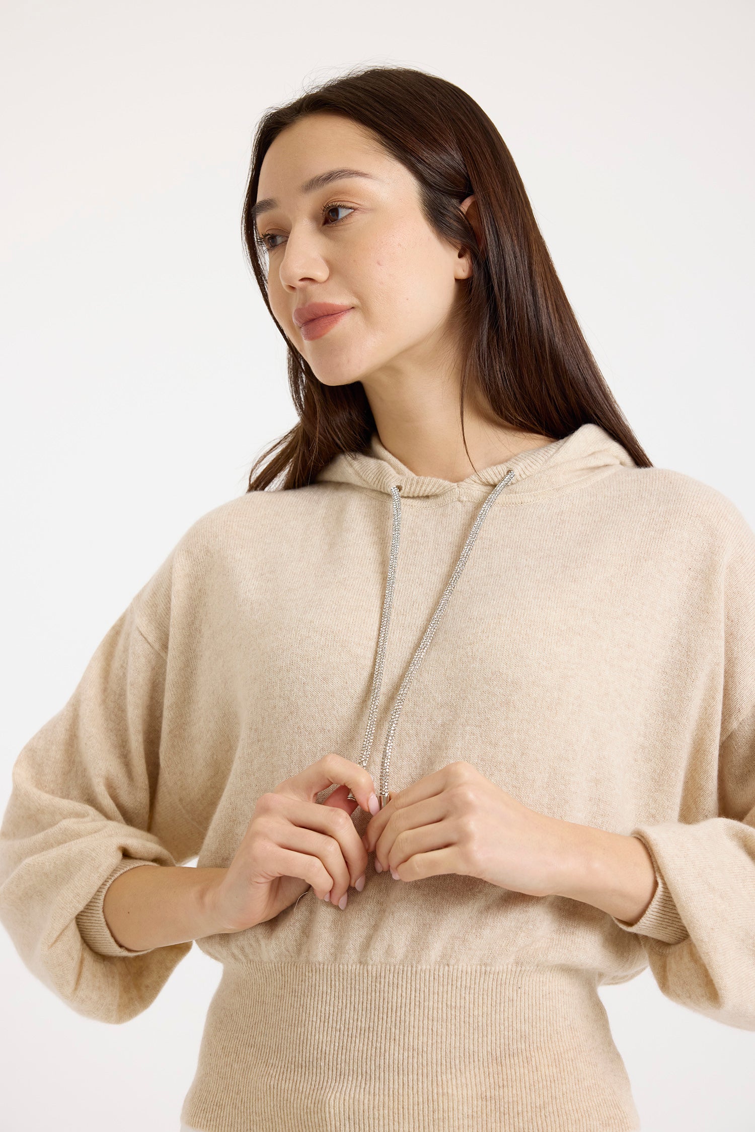 beige cashmere hoodie with rhinestone drawstring model shot