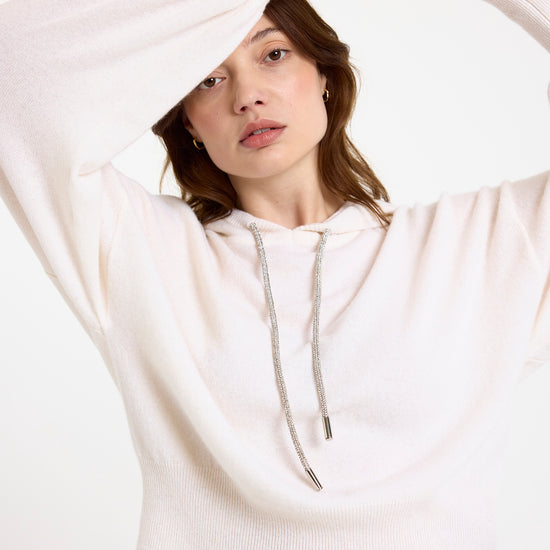 white hoodie with rhinestone drawstrings model shot