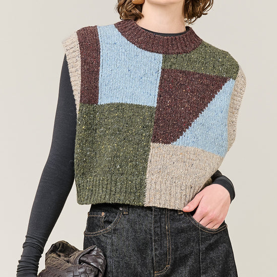 woman wearing multi colour geometric knit vest 