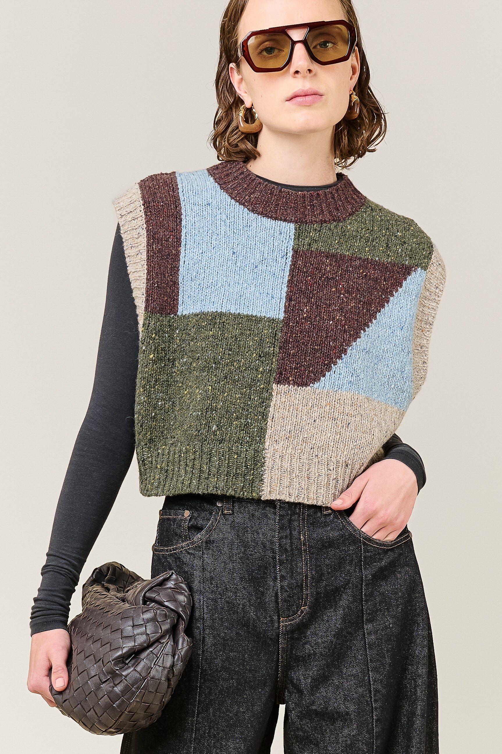 woman wearing multi colour geometric knit vest 