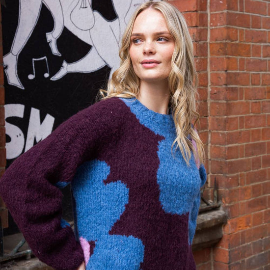 chunky round neck chocolate  jumper with mary quant style floral print in blue and pink side view 