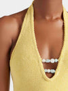 Close up neck detail of one size yellow swimsuit from Hunza G