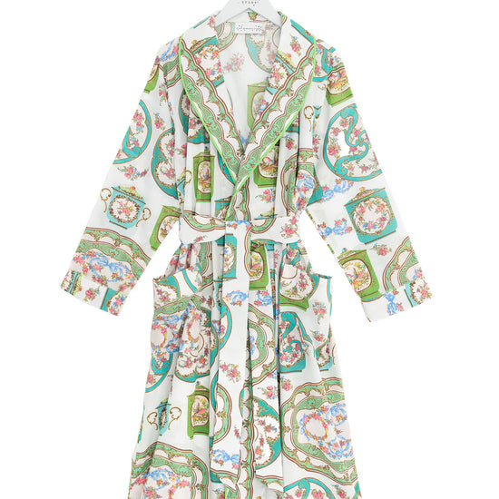 Patterned robe on a hanger against a white background