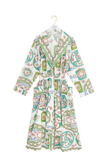 Patterned robe on a hanger against a white background