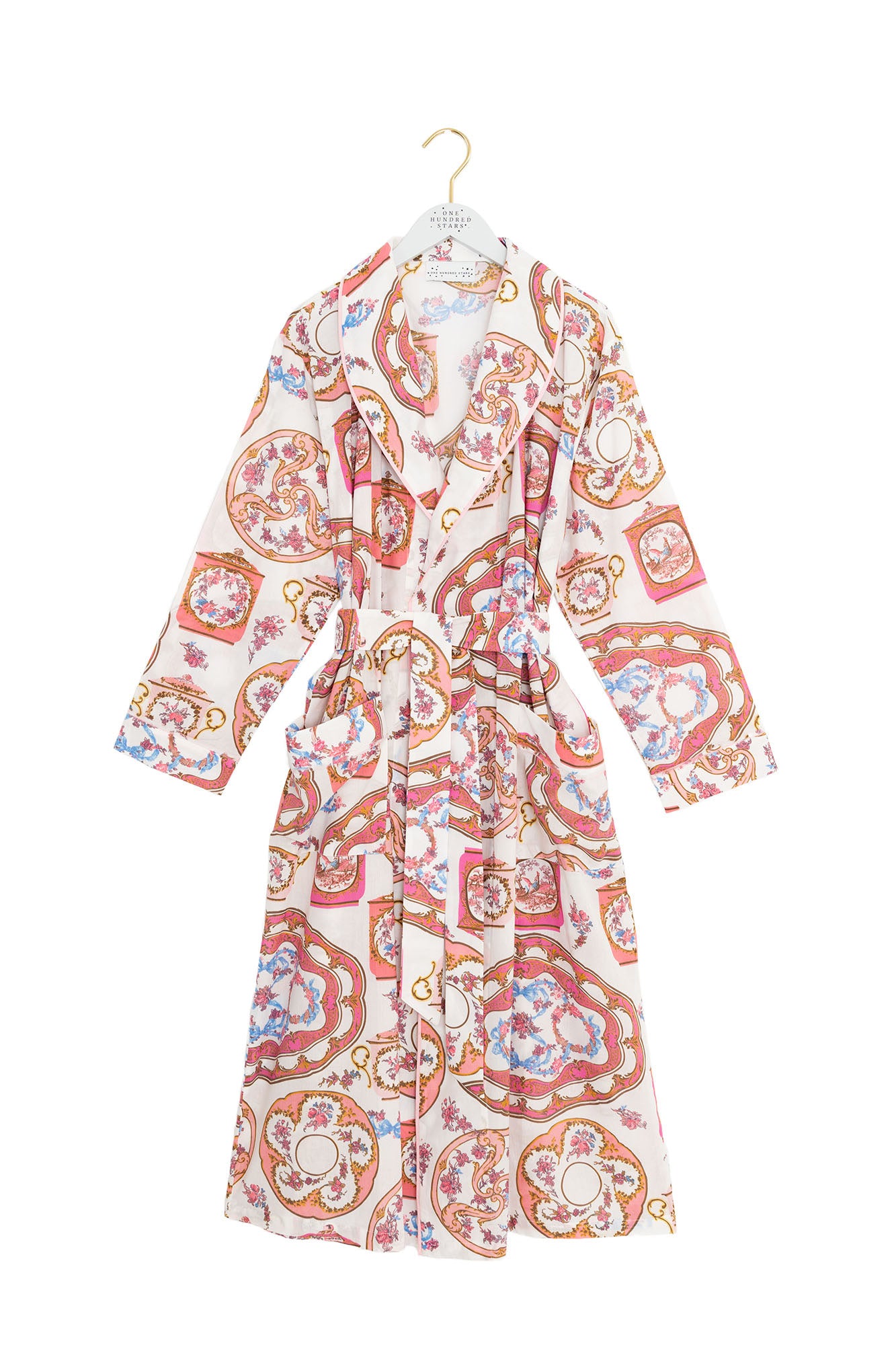 Patterned robe on a hanger against a white background