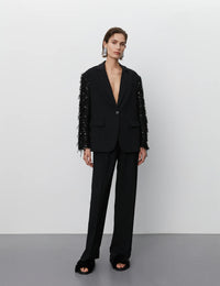 xBlack blazer with single breasted features and sequin and tassel sleeves black