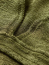 Close up of fabrication on green bikini