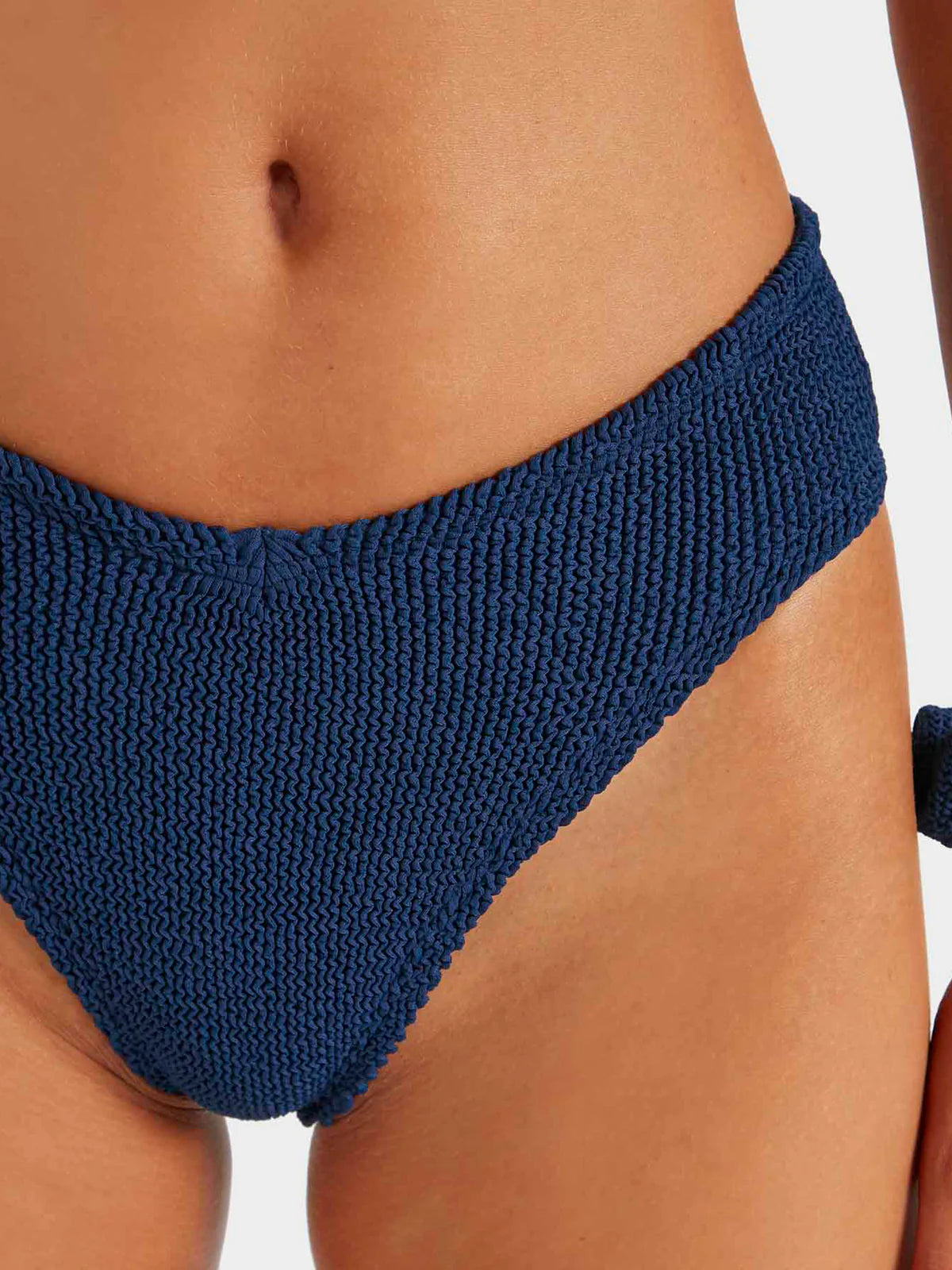Close up of navy bikini bottoms from HunzaG
