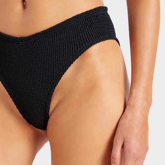 Close up of black bikini bottoms from HunzaG