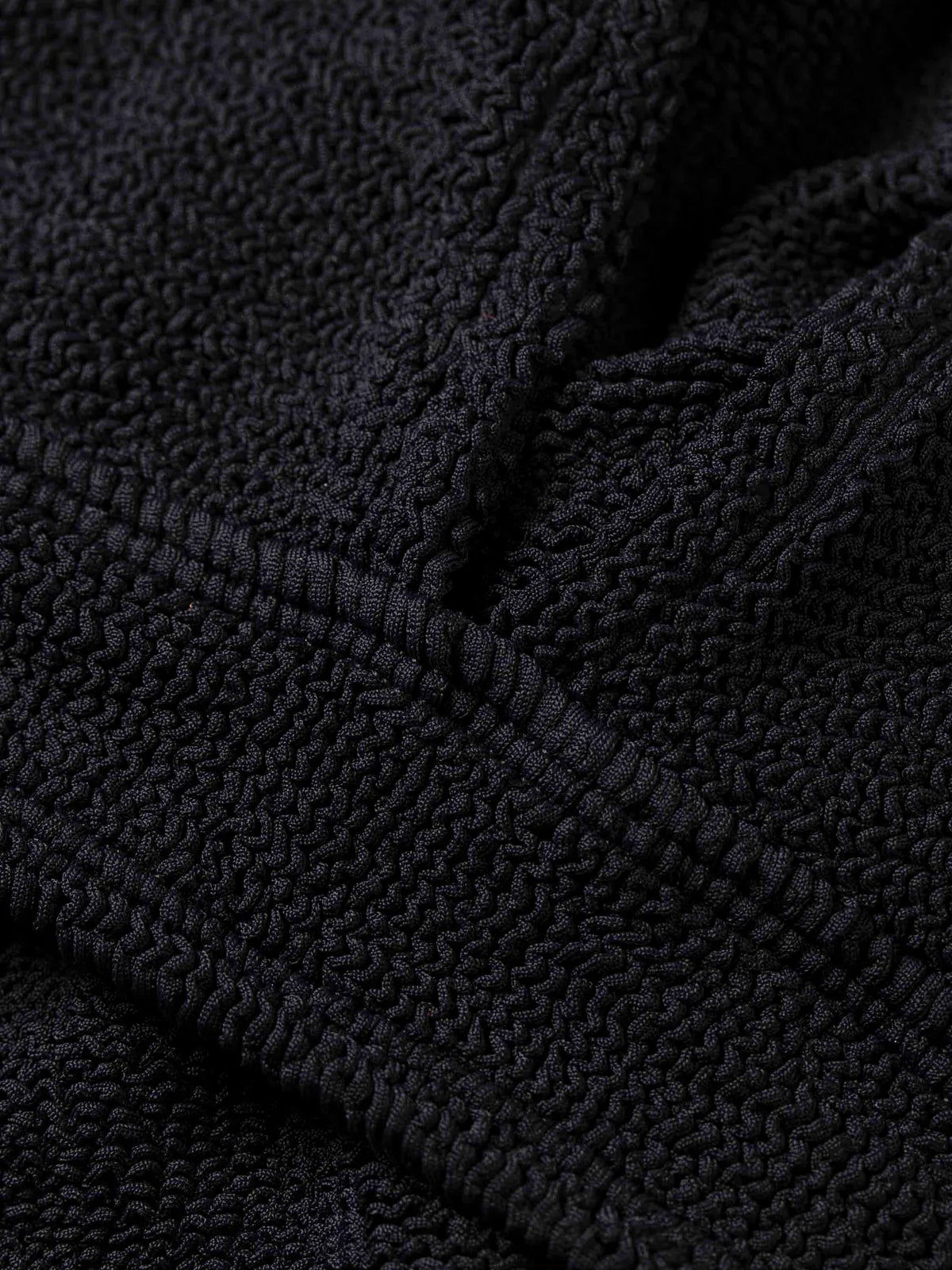 close up of black fabric of one size bikini from HunzaG