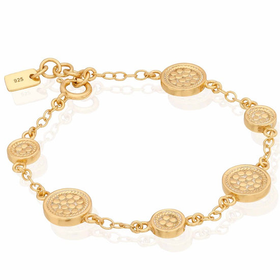 Gold bracelet with circular charms with dotting