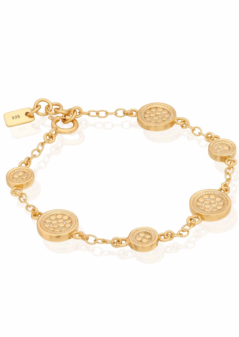 Gold bracelet with circular charms with dotting