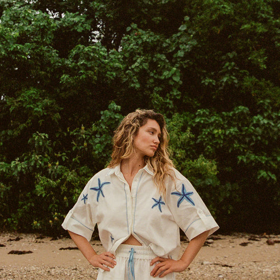 white shorts with blue starfish with elasticated drawstring waist model shot