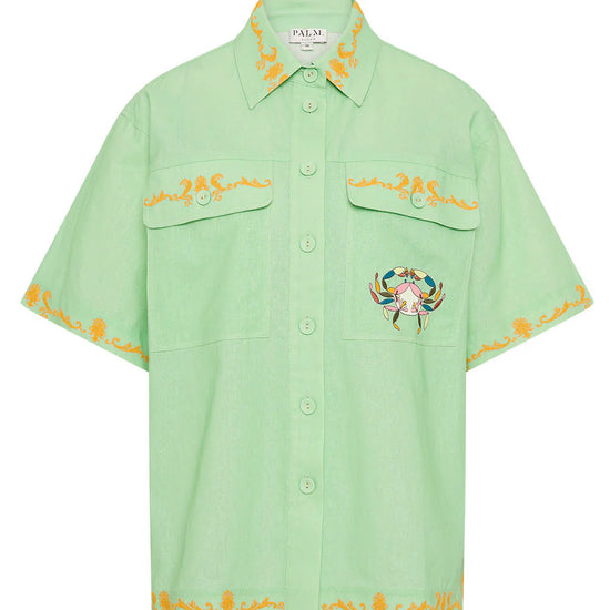 short sleeve light green oversized linen shirt with button flap pockets and crab on pockets from palm noosa