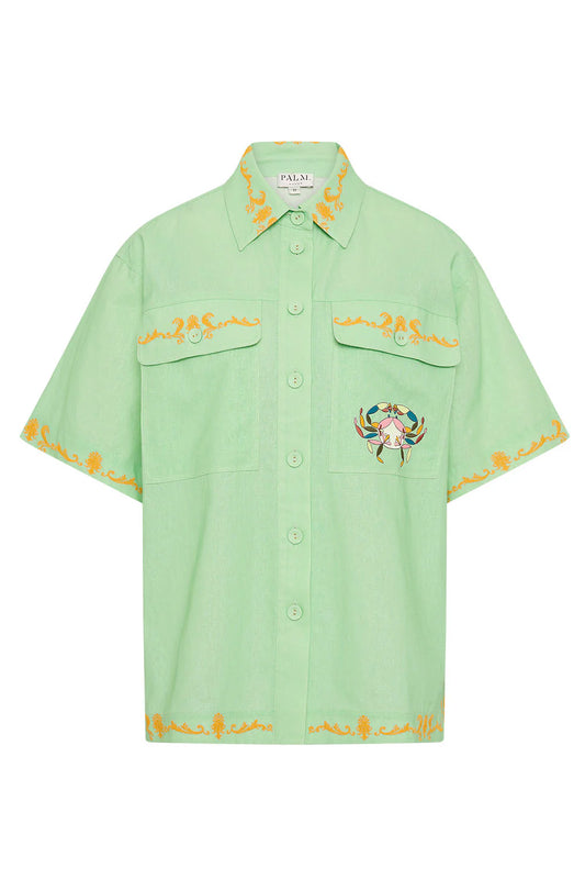 short sleeve light green oversized linen shirt with button flap pockets and crab on pockets from palm noosa