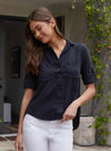 Black shirt with two chest pockets roll up arms classic collar and split back hem