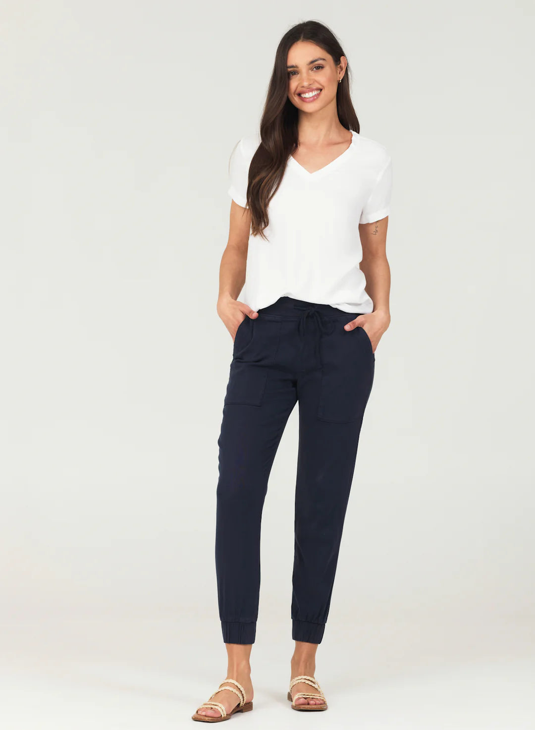 Navy jogger pants with pockets and elasticated cuffs