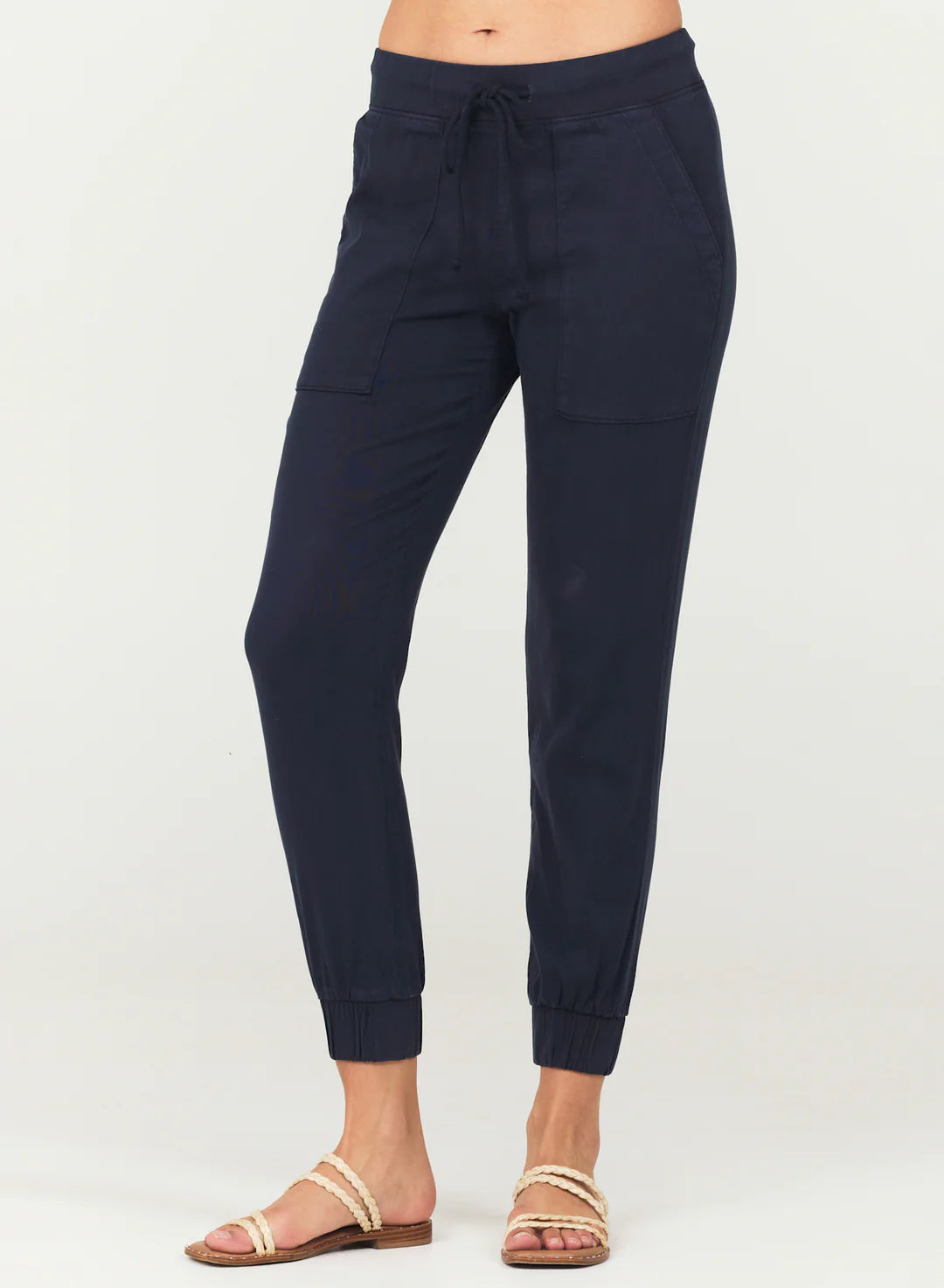Navy jogger pants with pockets and elasticated cuffs