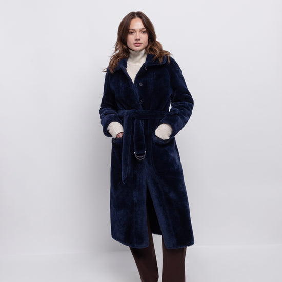 navy blue faux fur reversible coat with belt and mid length model shot