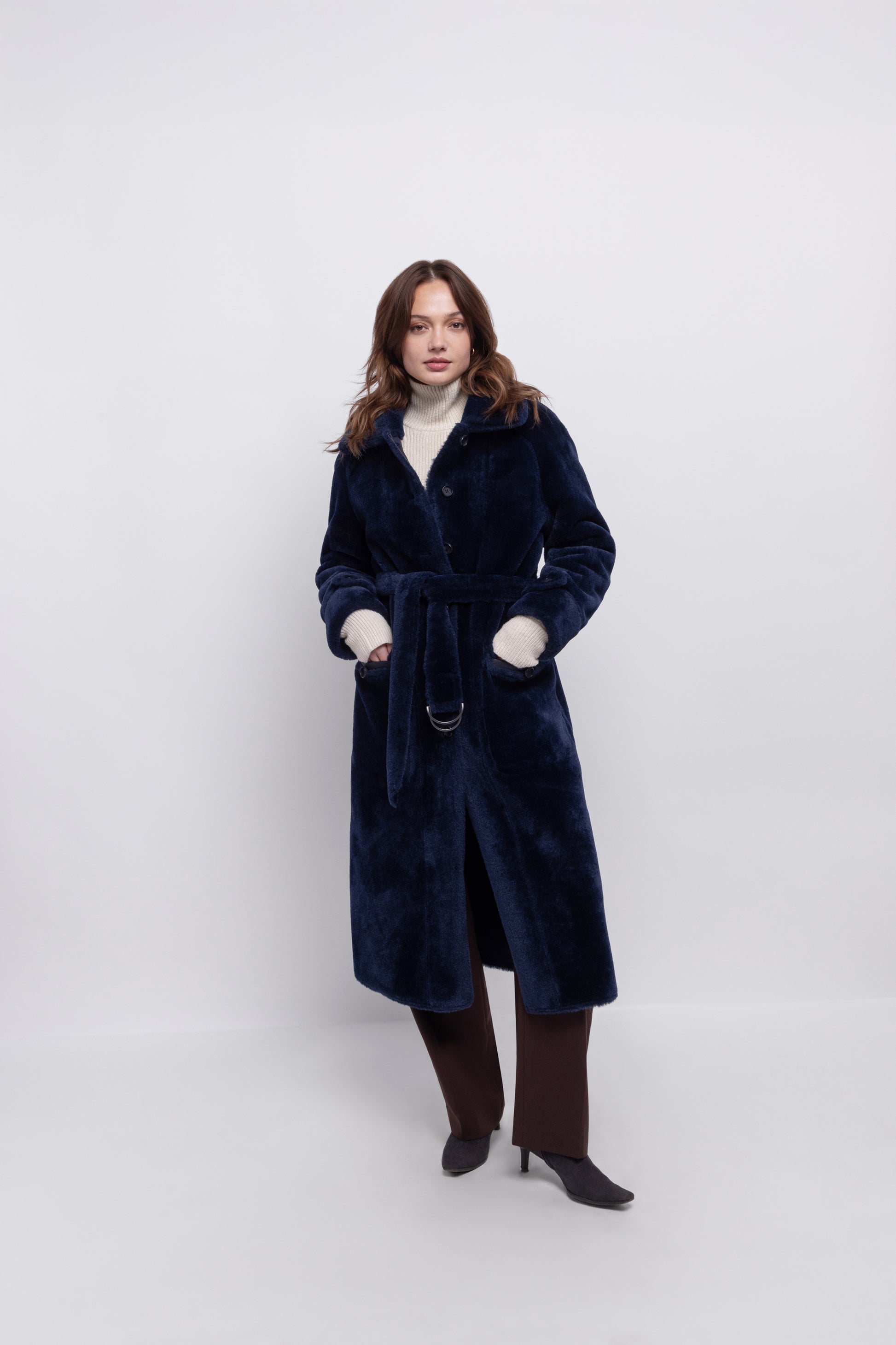 navy blue faux fur reversible coat with belt and mid length model shot