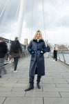 navy blue faux fur reversible coat with belt and mid length model shot