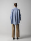 blue striped shirt with wide sleeves and dipped hem with chest pockets rear view