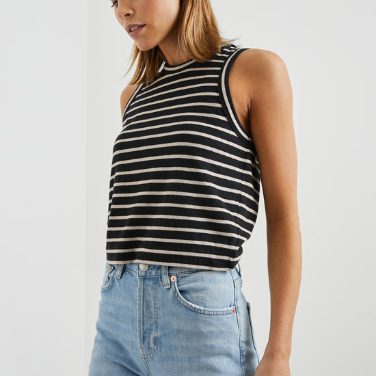 Sleeveless black and neutral stripe top with a round neck